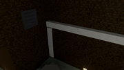 You can jump on top of the wall frame above the cells through the Cafeteria vent.